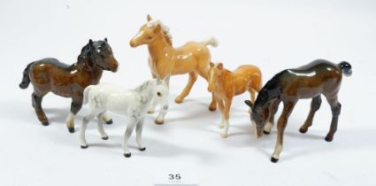 A collection of five Beswick foals