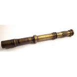 A 19th century brass telescopic gun sight lens