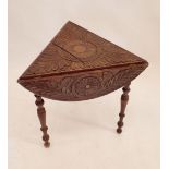 A Victorian circular carved occasional table folding down to make a triangle, 66cm diameter