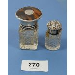 A silver and tortoiseshell lidded cut glass toiletry bottle, London 1863 and a silver topped