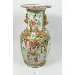 A large 19th century Canton famille rose vase painted panels of birds, flowers and figures, with