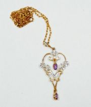 A 9 carat gold Art Nouveu style openwork pendant set amethyst and a 9 carat gold chain, 5.1g