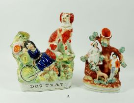 A Victorian Staffordshire group 'Dog Tray' with girl sleeping by hoop and spaniel 22cm tall and