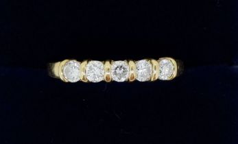 An 18 carat gold five stone diamond ring, size N to O