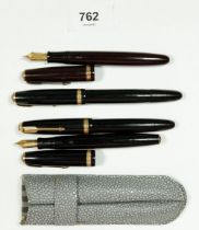 Three Parker Duofold fountain pens and one other Parker pen