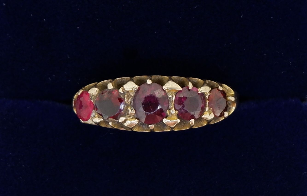 A Victorian 9 carat gold five stone garnet ring, size L