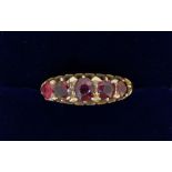 A Victorian 9 carat gold five stone garnet ring, size L