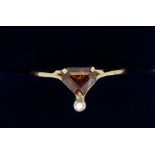 A 9 carat gold ring set orange stone - a/f and chip diamond, size O, 2g