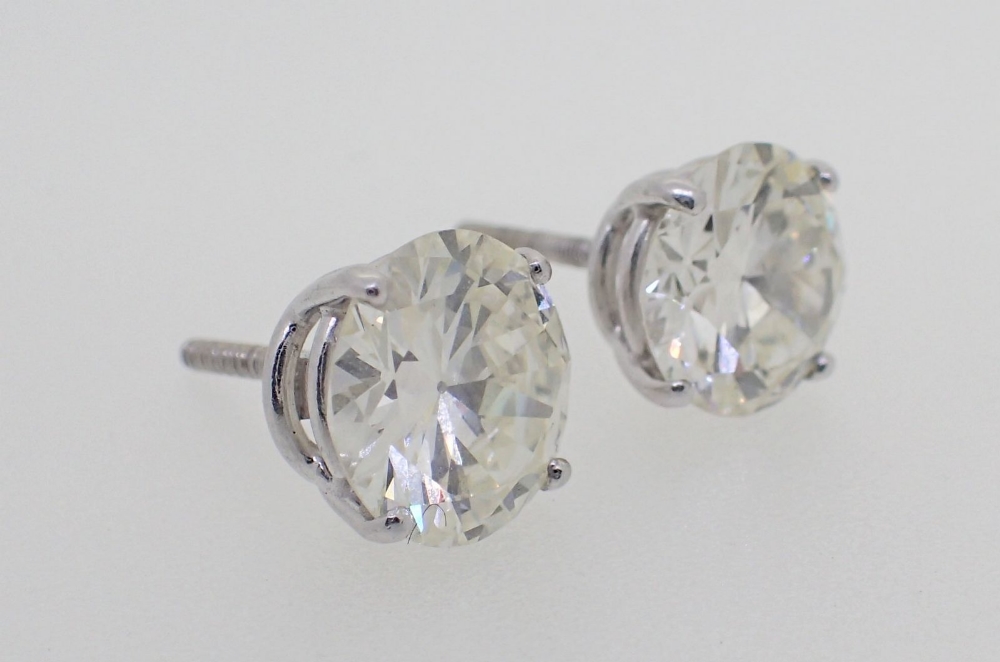 A pair of large 18 carat white gold diamond stud earrings, total 5.2 carats with screw backs - Image 4 of 4