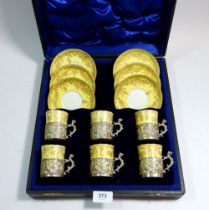 A Crown Stafford silver mounted coffee set with six yellow and gilt cups and saucers in fitted case,