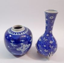 A Japanese blue and white vase painted flowers on a crackle ground all raised on three bisque feet