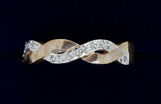 A 9 carat gold diamond set intertwined ring, size O, 2.5g
