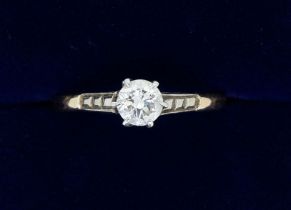 An 18 carat gold and platinum set diamond solitaire ring, size M, 1.9g