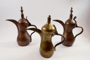 Three Turkish brass coffee pots, tallest 30cm