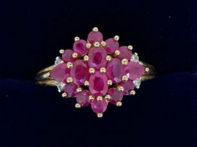 A 9 carat gold ruby cluster ring with chip diamonds to shoulders, 3.4g, size P to Q