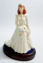 A Royal Doulton bridal figure The Duchess of Windsor, 210/1500 HN3086, boxed with stand