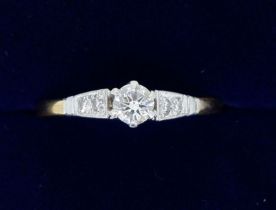 A 9 carat and 18 carat gold diamond ring, size N-O, 2.9g