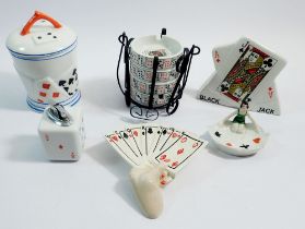 A collection of china and glass relating to playing cards including perfume bottles, ashtrays,