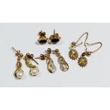 Two pairs of gold earrings and two yellow metal ones, total weight 3.7g