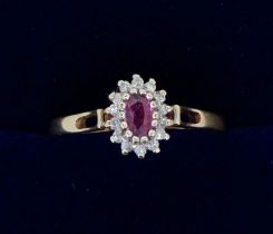 A 9 carat gold oval cluster ring set ruby and diamonds, size O-P, 1.7g