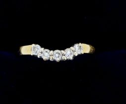 An 18 carat gold ring set curved line of five diamonds, size P, 3.2g