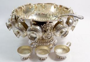 A large silver plated punch bowl with eighteen cups and ladle, 32cm