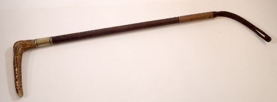 A vintage leather braided riding crop with horn handle and plated collar, total length 62cm