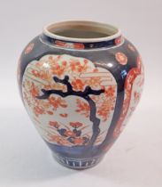 A Japanese Imari vase painted panels of trees and flowers, 17cm