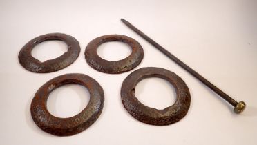 A Victorian cast iron Quoits set with pin and four rings