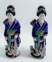 A pair of Japanese pottery Geisha figures in traditional robes, one a/f 25cm tall