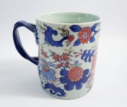 A large Ironstone china mug with twist handle, 15cm high