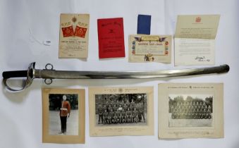 An officers cavalry sword with metal scabbard, blade 87cm long, with related military ephemera for