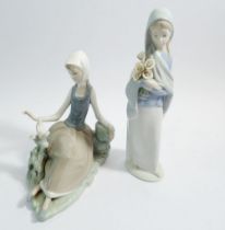 Two Lladro figures of ladies with bird and flowers, 23cm tall