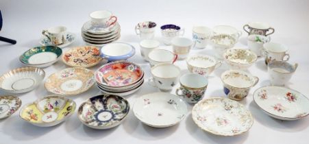 A collection of antique teacups and saucers, mostly not matching