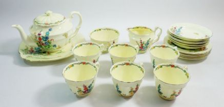 A Crown Staffordshire tea service comprising teapot, six cups and saucers, jug, sugar, six tea