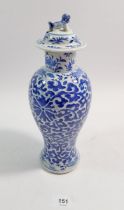 A Chinese late Qing blue and white baluster vase and cover decorated stylised flowers, four