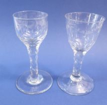 Two antique small wine glasses with facet cut stems and engraved swag decoration to bowl, 13cm