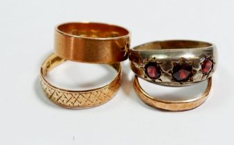 Two 9 carat gold wedding bands, 4.8g, a yellow metal ring and a silver ring set garnets