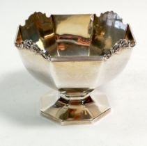 A silver octagonal sugar bowl on pedestal foot, 180g, Birmingham 1911