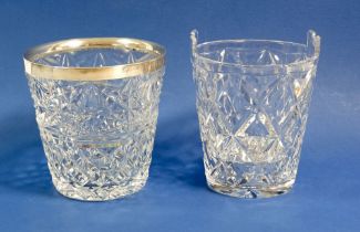 A cut glass ice bucket with silver rim and a cut glass ice bucket