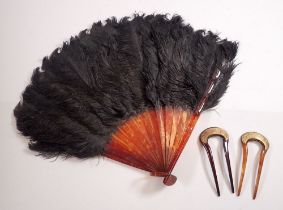 A pair of tortoiseshell and gilt metal hair combs, 11.5cm and a faux tortoiseshell and ostrich