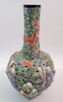 A Chinese famille verte vase with pierced body and moulded monks and dragons decoration, Kang Shi