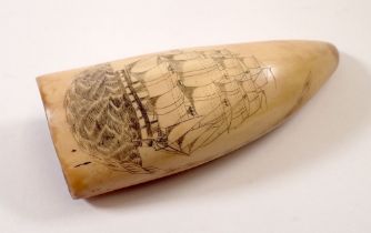 A whales tooth scrimshaw with whale and sailing ship decoration, 14cm