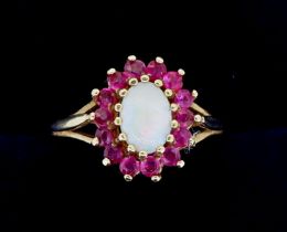 A 9 carat gold opal and garnet cluster ring, 2.8g, size N-O