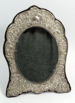 An Edwardian silver easel mirror with embossed decoration, Birmingham 1909 by Henry Matthews, 33 x
