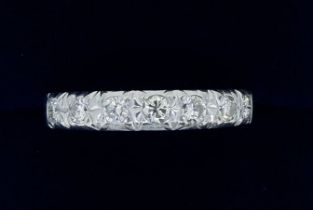A white gold seven stone diamond ring, size S, 3.8g