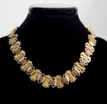 A Victorian two colour 15 carat gold Gothic link collar necklace (with spare link), current length