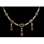 A Victorian gold pendant necklace in suffragette colours set seed pearls and peridot, with three