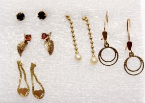 A 9 carat gold pair of earrings plus four yellow metal earrings