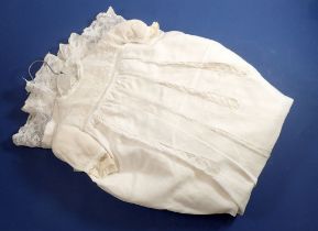 A silk christening gown with inset lace panels